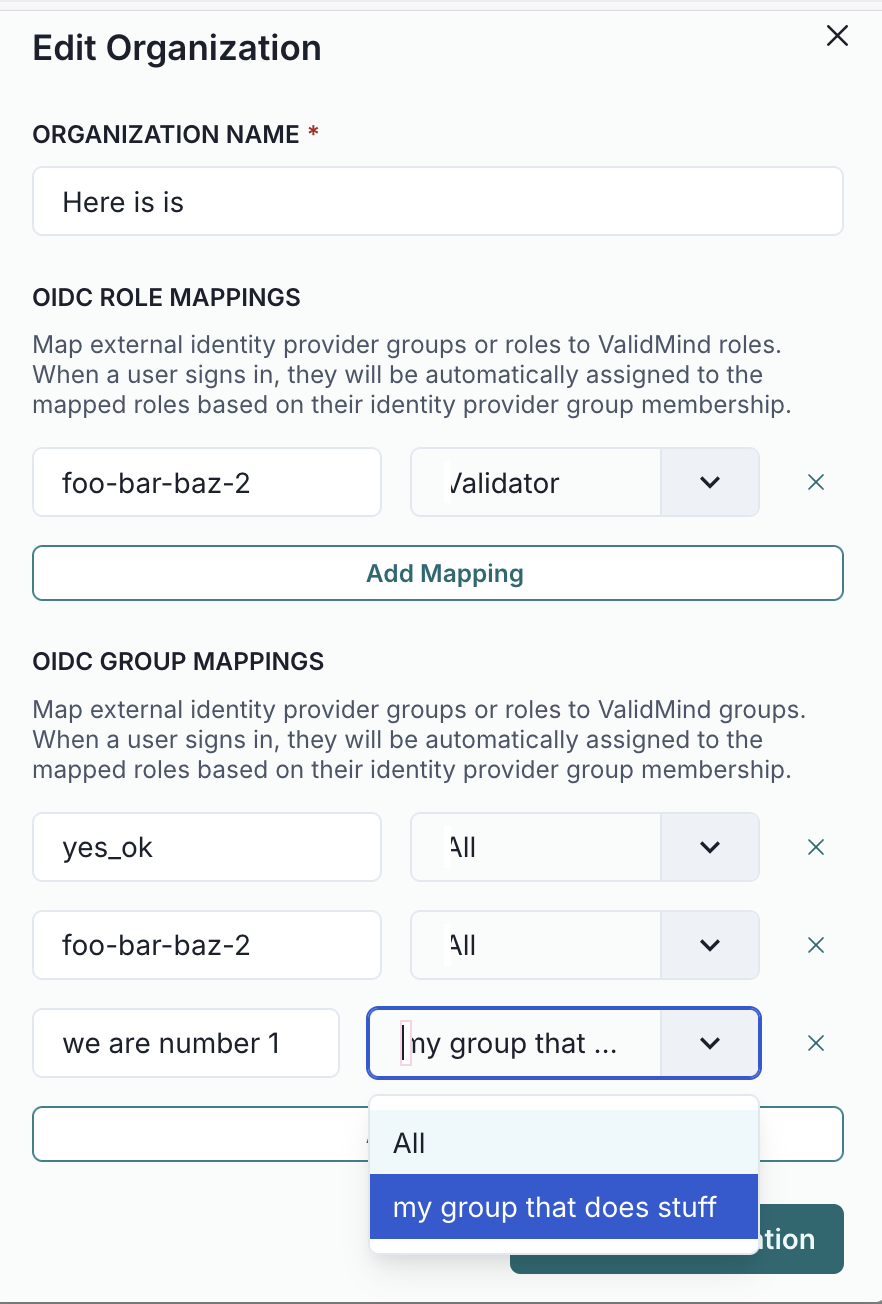 A form interface titled Edit Organization with fields and dropdown menus for configuring OIDC role and group mappings. At the top, there is a text field labeled Organization Name with a red asterisk, indicating it is required. Below, the OIDC Role Mappings section includes a text field with the value foo-bar-baz-2 and a dropdown menu set to /alidator, with an Add Mapping button beneath. The OIDC Group Mappings section contains three rows, each with a text field and a dropdown menu; the first row shows yes_ok and All, the second row shows foo-bar-baz-2 and All, and the third row shows we are number 1 with an open dropdown displaying options including my group that does stuff. At the bottom right, there is a blue Save button.