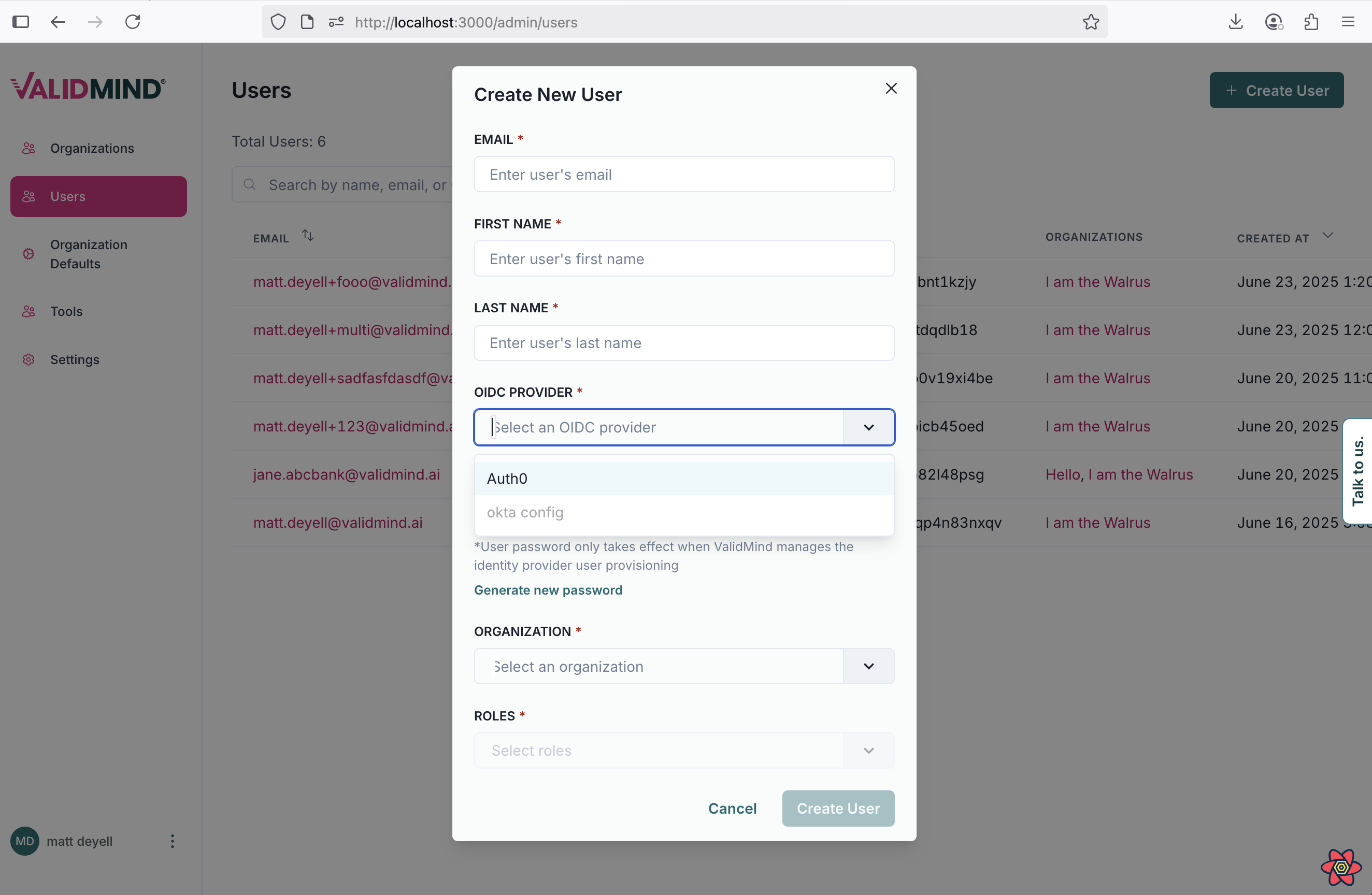 A web interface for creating a new user is displayed, with a modal window titled Create New User in the center. The form includes text fields for Email, First Name, and Last Name, followed by a dropdown menu labeled OIDC Provider with the default option Select an OIDC provider. Below, there is a text field for Organization and a dropdown for Roles, both with placeholder text. A blue Create User button is located at the bottom right of the modal. In the background, a sidebar on the left shows menu items for Users and Organization Details, with Users highlighted in red, and a list of existing users is partially visible on the right.