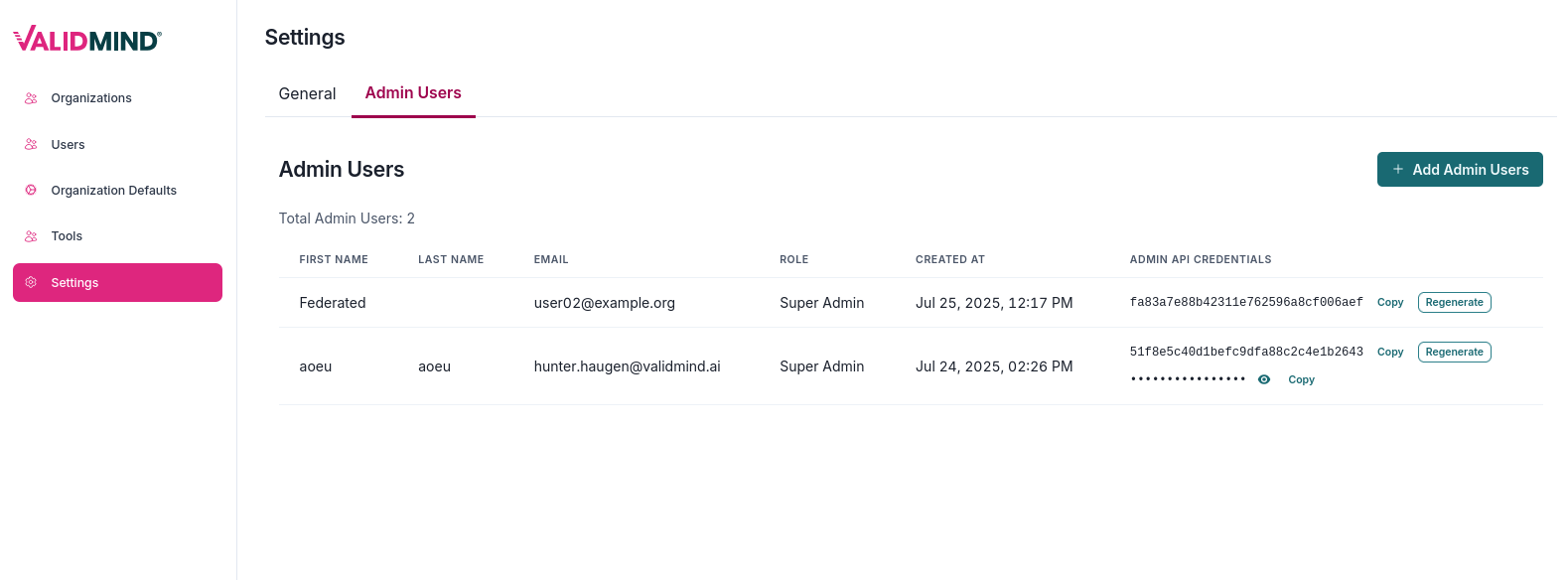 A web interface titled Settings with a tabbed layout showing two tabs: General and Admin Users, with Admin Users selected. Below the tab, there is a section titled Admin Users displaying a table with columns labeled Type, Name, Email, Role, Created At, and Admin API Credentials. The table lists two entries: the first row shows Federated, user1@example.org, Super Admin, and a creation date of Jul 25, 2023, 12:17 PM, with options to Copy and Regenerate credentials; the second row shows Local, hunter.haugen@validmind.ai, Super Admin, and a creation date of Jul 24, 2023, 2:22:56 PM, with a Copy option. A blue Add Admin Users button is located in the top right corner. The interface has a pink vertical navigation menu on the left with options for Organizations, Users, Organization Defaults, and Settings.