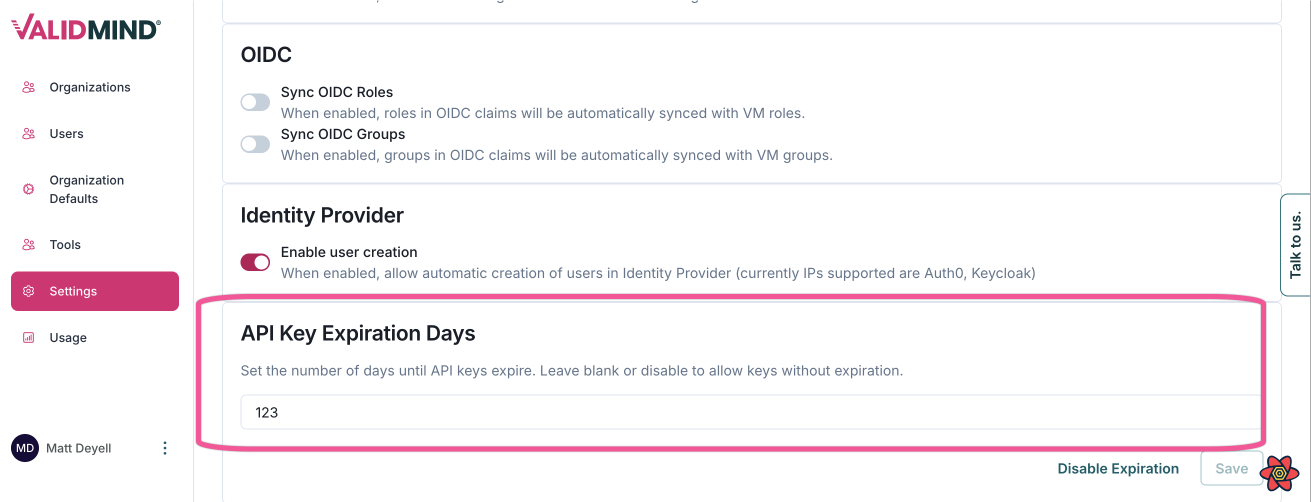A web interface displaying settings for an application titled ValidMind. On the left, a vertical navigation menu with pink icons includes options like Settings and Usage. The main section features a settings page with a heading OIDC and options such as Sync OIDC Roles with a toggle switch. Below, sections for Identity Provider with an Enable user creation toggle, and API Key Expiration Days with a text field containing the number 123 and a Disable Expiration link. The bottom half shows a browser developer console with tabs like Elements, Console, and Network, displaying network activity details.